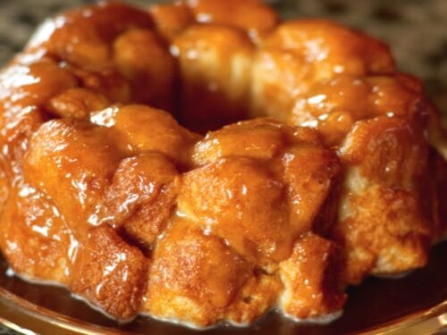 Golden-brown bundt cake with glossy caramel coating and distinctive knobbed surface