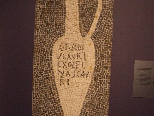 Mosaic tile image of an amphora with Latin text inscribed on its body