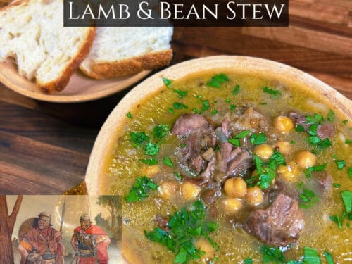 Earthenware bowl of lamb and chickpea stew with green herbs, sliced bread on wooden table