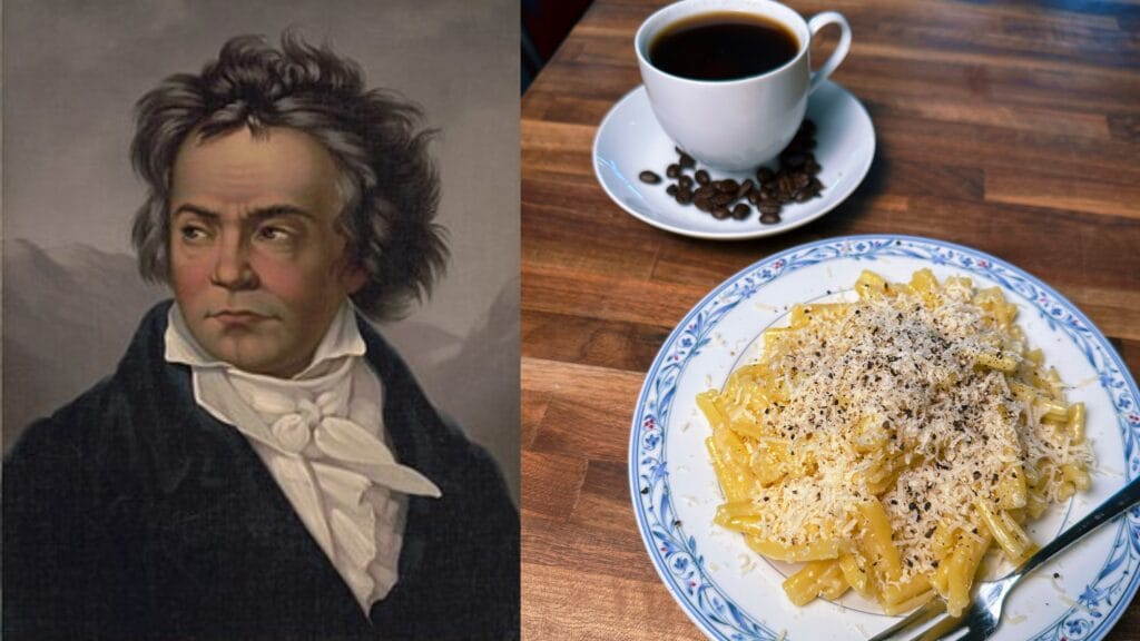 Cooked elbow pasta with grated cheese and black pepper on a blue-decorated plate, with a cup of black coffee and coffee beans nearby